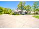 Beautiful brick home with circular driveway, mature trees, and lush landscaping in a lovely neighborhood at 1105 Deer Creek Dr, Anderson, IN 46011