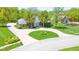 Beautiful brick home with circular driveway, mature trees, and lush landscaping in a lovely neighborhood at 1105 Deer Creek Dr, Anderson, IN 46011