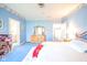Spacious blue bedroom with a bright window, offering a tranquil retreat with ample room for furnishings at 1105 Deer Creek Dr, Anderson, IN 46011