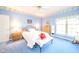 Comfortable blue bedroom with decorative trim, bright window, and classic furnishings for a cozy retreat at 1105 Deer Creek Dr, Anderson, IN 46011