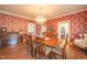 Spacious dining room with wood table, chandelier, and classic decor, perfect for entertaining at 1105 Deer Creek Dr, Anderson, IN 46011