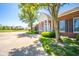 Charming brick home with a welcoming front porch, landscaped bushes, and a spacious driveway at 1105 Deer Creek Dr, Anderson, IN 46011