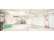 Spacious three-car garage with ample storage and overhead lighting at 1105 Deer Creek Dr, Anderson, IN 46011