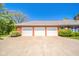 Spacious brick home with three-car garage and manicured landscaping at 1105 Deer Creek Dr, Anderson, IN 46011