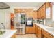 Modern kitchen featuring stainless steel appliances, generous cabinet space, and light countertops at 1105 Deer Creek Dr, Anderson, IN 46011