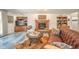 Inviting living room with a fireplace, built-in bookshelves, and comfortable seating at 1105 Deer Creek Dr, Anderson, IN 46011