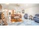 Spacious living room with high ceilings, leather furniture, and unique flooring at 1105 Deer Creek Dr, Anderson, IN 46011