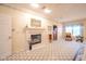 Inviting main bedroom features a cozy fireplace, a seating area, and ample space for relaxation and comfort at 1105 Deer Creek Dr, Anderson, IN 46011