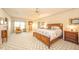 Expansive main bedroom featuring a decorative ceiling fan and an abundance of natural light at 1105 Deer Creek Dr, Anderson, IN 46011