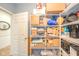 Organized storage room with ample shelving and a variety of storage containers at 1105 Deer Creek Dr, Anderson, IN 46011