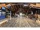 Spacious attic with exposed wooden beams, wooden flooring, and natural light at 114 E 44Th St, Indianapolis, IN 46205