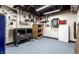 Basement featuring workspace, pegboard walls, and durable flooring for projects at 114 E 44Th St, Indianapolis, IN 46205