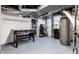Basement featuring a game table, water heater and access to utility area at 114 E 44Th St, Indianapolis, IN 46205