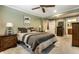 Comfortable bedroom with a large bed, neutral tones, and ample natural light from the windows at 114 E 44Th St, Indianapolis, IN 46205