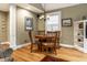 Inviting dining room featuring a wooden table, chandelier, and natural lighting from the window at 114 E 44Th St, Indianapolis, IN 46205