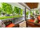 Relaxing front porch with wicker furniture and a ceiling fan at 114 E 44Th St, Indianapolis, IN 46205