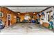Open garage showcasing ample space, an array of tools, and convenient storage solutions at 114 E 44Th St, Indianapolis, IN 46205