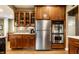 Bright kitchen showcasing stainless steel refrigerator, double oven, and ample cabinet space at 114 E 44Th St, Indianapolis, IN 46205