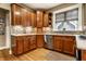 Well-designed kitchen with wooden cabinets, stainless appliances, and tile backsplash at 114 E 44Th St, Indianapolis, IN 46205