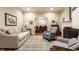 Spacious living room with a fireplace and an open view to the dining room at 114 E 44Th St, Indianapolis, IN 46205