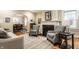 Elegant living room with a fireplace and an open view to the dining room at 114 E 44Th St, Indianapolis, IN 46205