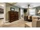The main bedroom features a large dresser, ensuite closet, and a ceiling fan at 114 E 44Th St, Indianapolis, IN 46205