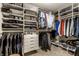 Well-organized walk-in closet with custom shelving, hanging racks, and storage for clothing at 114 E 44Th St, Indianapolis, IN 46205