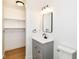 This bathroom features a sleek gray vanity, stylish lighting, and a modern mirror at 11816 Wapiti Way, Noblesville, IN 46060