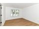 Bedroom with light wood flooring and a window overlooking the pond at 11816 Wapiti Way, Noblesville, IN 46060