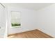Bright bedroom with a window letting in natural light, and wood-look flooring at 11816 Wapiti Way, Noblesville, IN 46060