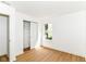 Bright bedroom with a window letting in natural light, a spacious closet, and wood-look flooring at 11816 Wapiti Way, Noblesville, IN 46060