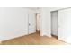 Bright bedroom features wood-look flooring and closet with sliding doors at 11816 Wapiti Way, Noblesville, IN 46060