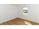 This bedroom features a window letting in natural light and wood-look flooring at 11816 Wapiti Way, Noblesville, IN 46060