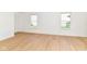 Sun-filled living area showcasing pristine walls, new floors, and ample natural light at 11816 Wapiti Way, Noblesville, IN 46060