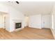 Spacious living room with neutral tones, wood floors, a cozy fireplace, and a welcoming atmosphere at 11816 Wapiti Way, Noblesville, IN 46060