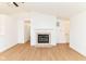 Bright living room features wood floors, modern fireplace, and open layout at 11816 Wapiti Way, Noblesville, IN 46060