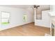 Open living room features wood floors, a modern ceiling fan, and great natural light at 11816 Wapiti Way, Noblesville, IN 46060