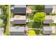 Aerial view of backyards with green lawns and outdoor patios with furniture and grills at 1311 E Michigan St, Indianapolis, IN 46202
