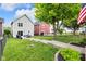 Large backyard with patio, grassy area, landscaping, and residential surroundings at 1311 E Michigan St, Indianapolis, IN 46202