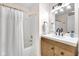 Bright bathroom features a shower and a modern vanity with a herringbone pattern at 1311 E Michigan St, Indianapolis, IN 46202