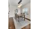 Bright dining space with natural light, a modern chandelier, and seating for four at 1311 E Michigan St, Indianapolis, IN 46202
