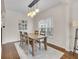 Inviting dining room featuring a wooden table, stylish lighting, and neutral decor at 1311 E Michigan St, Indianapolis, IN 46202