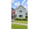 Charming two-story home with a well-manicured lawn and landscaped shrubbery at 1311 E Michigan St, Indianapolis, IN 46202