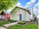 Charming garage features green siding and an American flag above the door at 1311 E Michigan St, Indianapolis, IN 46202