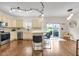 Open-concept kitchen with island seating, stainless steel appliances, and hardwood floors at 1311 E Michigan St, Indianapolis, IN 46202