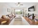 Bright and airy living room featuring hardwood floors, a large sectional, and a contemporary design at 1311 E Michigan St, Indianapolis, IN 46202