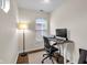 Well-lit office space with hardwood floors and a simple desk setup at 1311 E Michigan St, Indianapolis, IN 46202