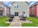 Relaxing patio with outdoor seating, a grill, and beautiful landscaping at 1311 E Michigan St, Indianapolis, IN 46202