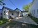 Charming backyard with a concrete patio and well-maintained lawn surrounded by lush greenery at 1314 Laurel St, Indianapolis, IN 46203