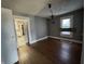 Dining room with hardwood floors and gray walls, showcasing potential for a cozy dining space after renovation at 1314 Laurel St, Indianapolis, IN 46203